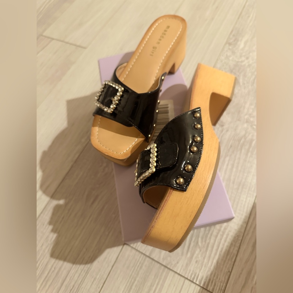 Madden Girl Anikka
Black Patent Mules with Rhinestone Buckle - Picture 2 of 4